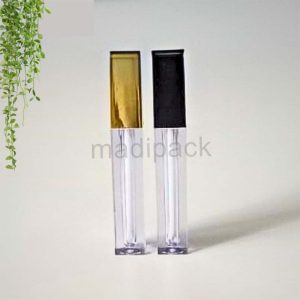 Tube carré brillant transparent avec capuchon doré/noir – Sophistication et brillance.